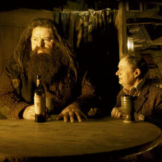 Robbie Coltrane stars as Rubeus Hagrid and Jim Broadbent stars as Horace Slughorn in Warner Bros Pictures' Harry Potter and the Half-Blood Prince (2009)