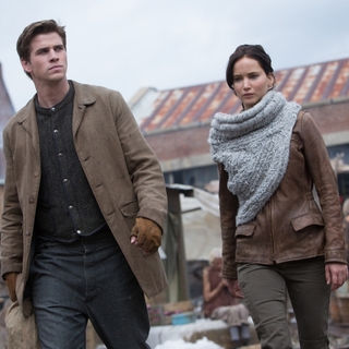 Liam Hemsworth stars as Gale Hawthorne and Jennifer Lawrence stars as Katniss Everdeen in Lionsgate Films' The Hunger Games: Catching Fire (2013)