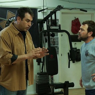 Joe Lo Truglio stars as Officer Fogerty and Rob Riggle stars as James Malone Sr. in Millennium Entertainment's High Road (2012)