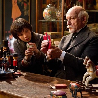 Asa Butterfield stars as Hugo Cabret and Christopher Lee stars as Monsieur Labisseqq in Paramount Pictures' Hugo (2011)