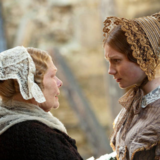 Judi Dench stars as Mrs. Fairfax and Mia Wasikowska stars as Jane Eyre in Focus Features' Jane Eyre (2011)