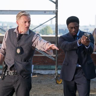 Callum Keith Rennie stars as Halloran and Cle Bennett stars as Detective Keith in Lionsgate Films' Jigsaw (2017)