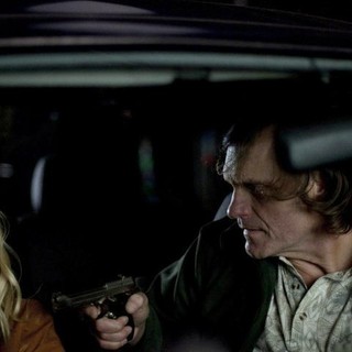 January Jones stars as Laura Gerard and Wayne Pere stars as cancer in Anchor Bay Films' Seeking Justice (2012)
