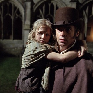 Isabelle Allen stars as Young Cosette and Hugh Jackman stars as Jean Valjean in Universal Pictures' Les Miserables (2012)