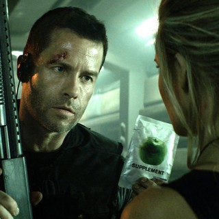 Guy Pearce stars as Snow and Maggie Grace stars as Emilie Warnock in Europa Corp.'s Lockout (2012)