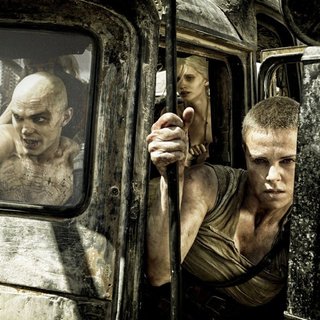 Nicholas Hoult stars as Nux and Charlize Theron stars as Imperator Furiosa in Warner Bros. Pictures' Mad Max: Fury Road (2015)