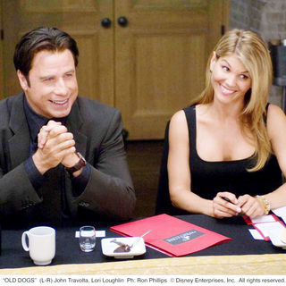 John Travolta (Charlie) and Lori Loughlin in Walt Disney Pictures' Old Dogs (2009). Photo credit by Ron Phillips.
