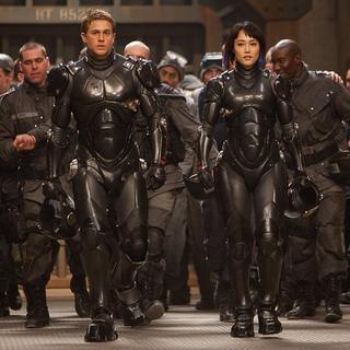 Charlie Hunnam stars as Raleigh Antrobus and Rinko Kikuchi stars as Mako Mori in Warner Bros. Pictures' Pacific Rim (2013)