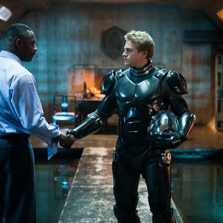 Idris Elba stars as Stacker Pentecost and Charlie Hunnam stars as Raleigh Antrobus in Warner Bros. Pictures' Pacific Rim (2013)