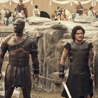 Adewale Akinnuoye-Agbaje stars as Atticus and Kit Harington stars as Milo in TriStar Pictures' Pompeii (2014)