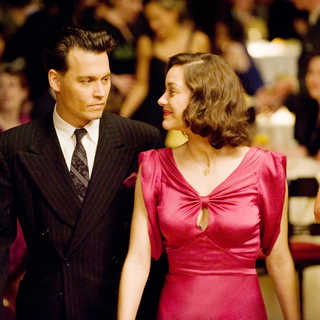Johnny Depp stars as John Dillinger and Marion Cotillard stars as Billie Frechette in Universal Pictures' Public Enemies (2009)