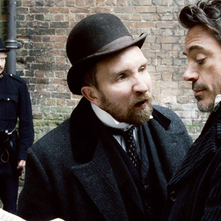 Eddie Marsan stars as Inspector Lestrade and Robert Downey Jr. stars as Sherlock Holmes in Warner Bros. Pictures' Sherlock Holmes (2009)