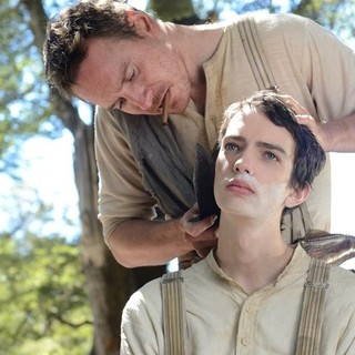 Michael Fassbender stars as Silas Selleck and Kodi Smit-McPhee stars as Jay Cavendish in A24's Slow West (2015)