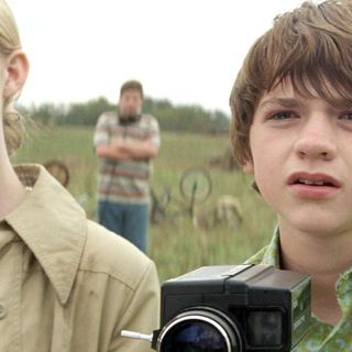 Elle Fanning stars as Alice Dainard and Joel Courtney stars as Joe Lamb in Paramount Pictures' Super 8 (2011)