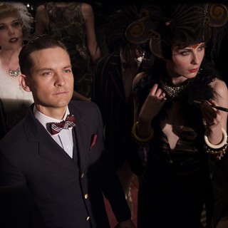 Tobey Maguire stars as Nick Carraway and Elizabeth Debicki stars as Jordan Baker in Warner Bros. Pictures' The Great Gatsby (2013)