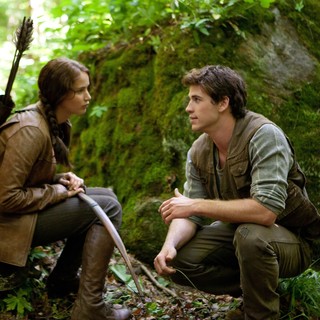 Jennifer Lawrence stars as Katniss Everdeen and Liam Hemsworth stars as Gale Hawthorne in Lionsgate Films' The Hunger Games (2012)