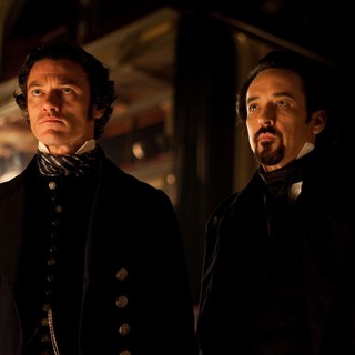 Luke Evans stars as Detective Emmett Fields and John Cusack stars as Edgar Allan Poe in Relativity Media's The Raven (2012)