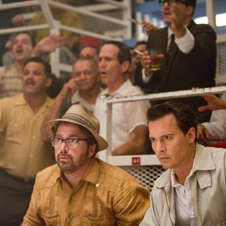 Michael Rispoli stars as Bob Sala and Johnny Depp stars as Paul Kemp in FilmDistrict's The Rum Diary (2011)