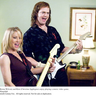 Christina Applegate stars as Kim and Rainn Wilson stars as Robert 'Fish' Fishman in 20th Century Fox's The Rocker (2008). Photo credit by George Kraychyk.