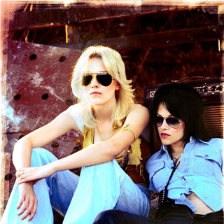 Dakota Fanning stars as Cherie Currie and Kristen Stewart stars as Joan Jett in Apparition's The Runaways (2010)