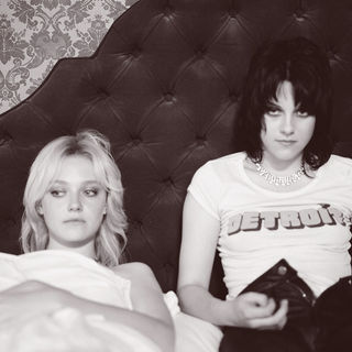 Dakota Fanning stars as Cherie Currie and Kristen Stewart stars as Joan Jett in Apparition's The Runaways (2010)