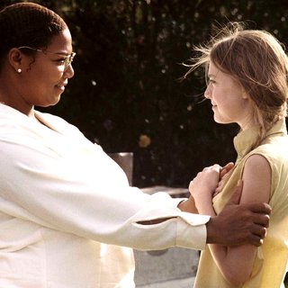 Queen Latifah stars as August Boatwright and Dakota Fanning stars as Lily Owens in Fox Searchlight Pictures' The Secret Life of Bees (2008). Photo credit by Sidney Baldwin.