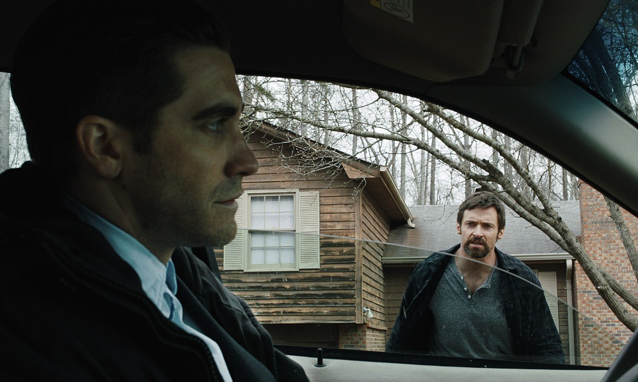 Jake Gyllenhaal stars as Detective Loki and Hugh Jackman stars as Keller Dover in Warner Bros. Pictures' Prisoners (2013)