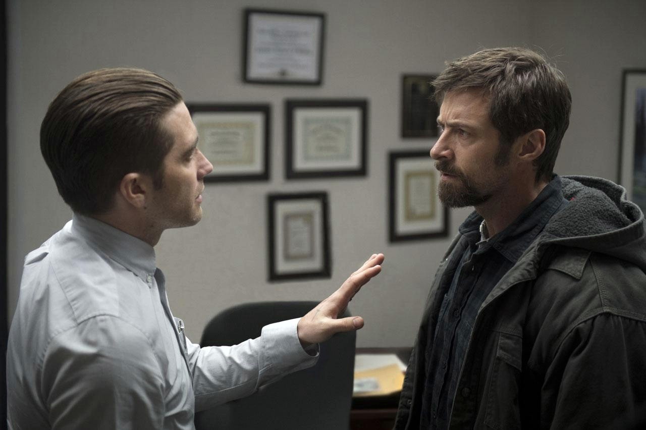 Jake Gyllenhaal stars as Detective Loki and Hugh Jackman stars as Keller Dover in Warner Bros. Pictures' Prisoners (2013)
