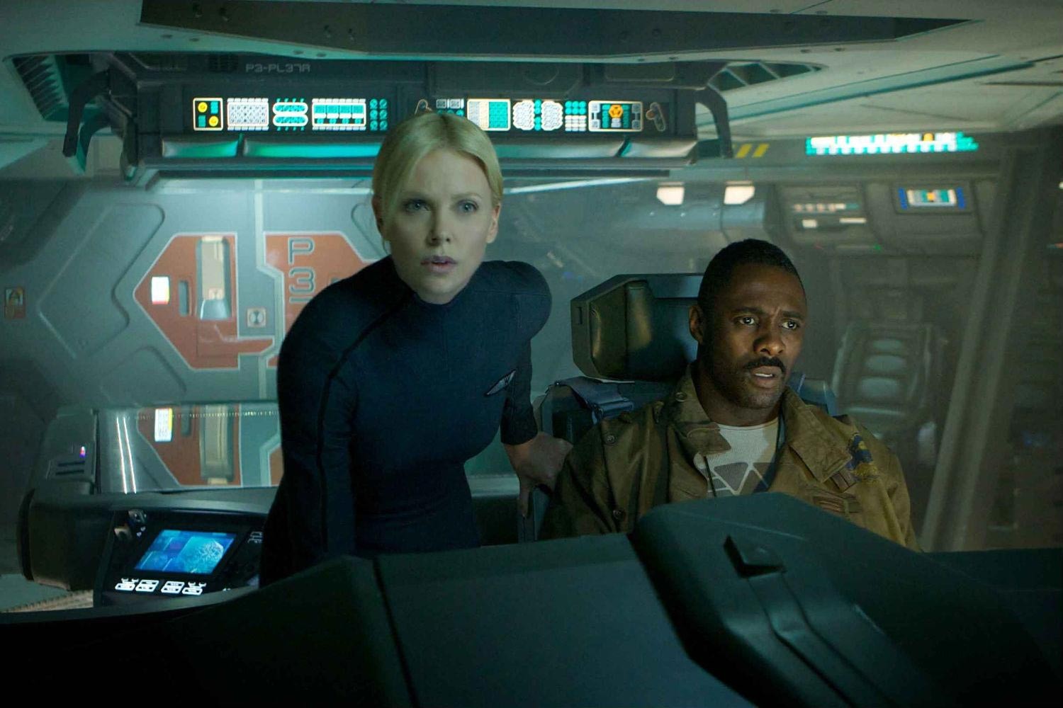 Charlize Theron stars as Meredith Vickers and Idris Elba stars as Captain Janek in 20th Century Fox's Prometheus (2012)