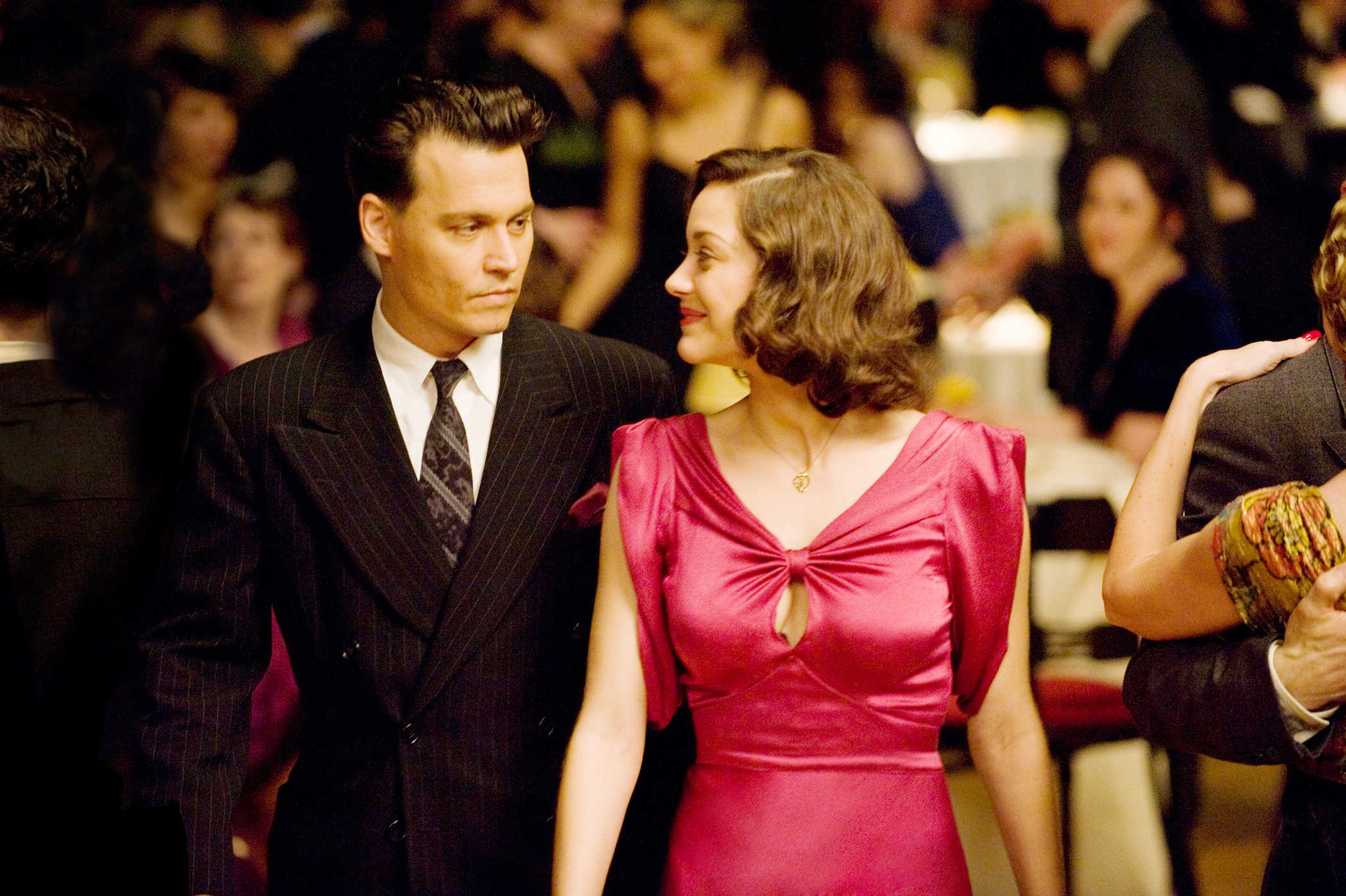 Johnny Depp stars as John Dillinger and Marion Cotillard stars as Billie Frechette in Universal Pictures' Public Enemies (2009)