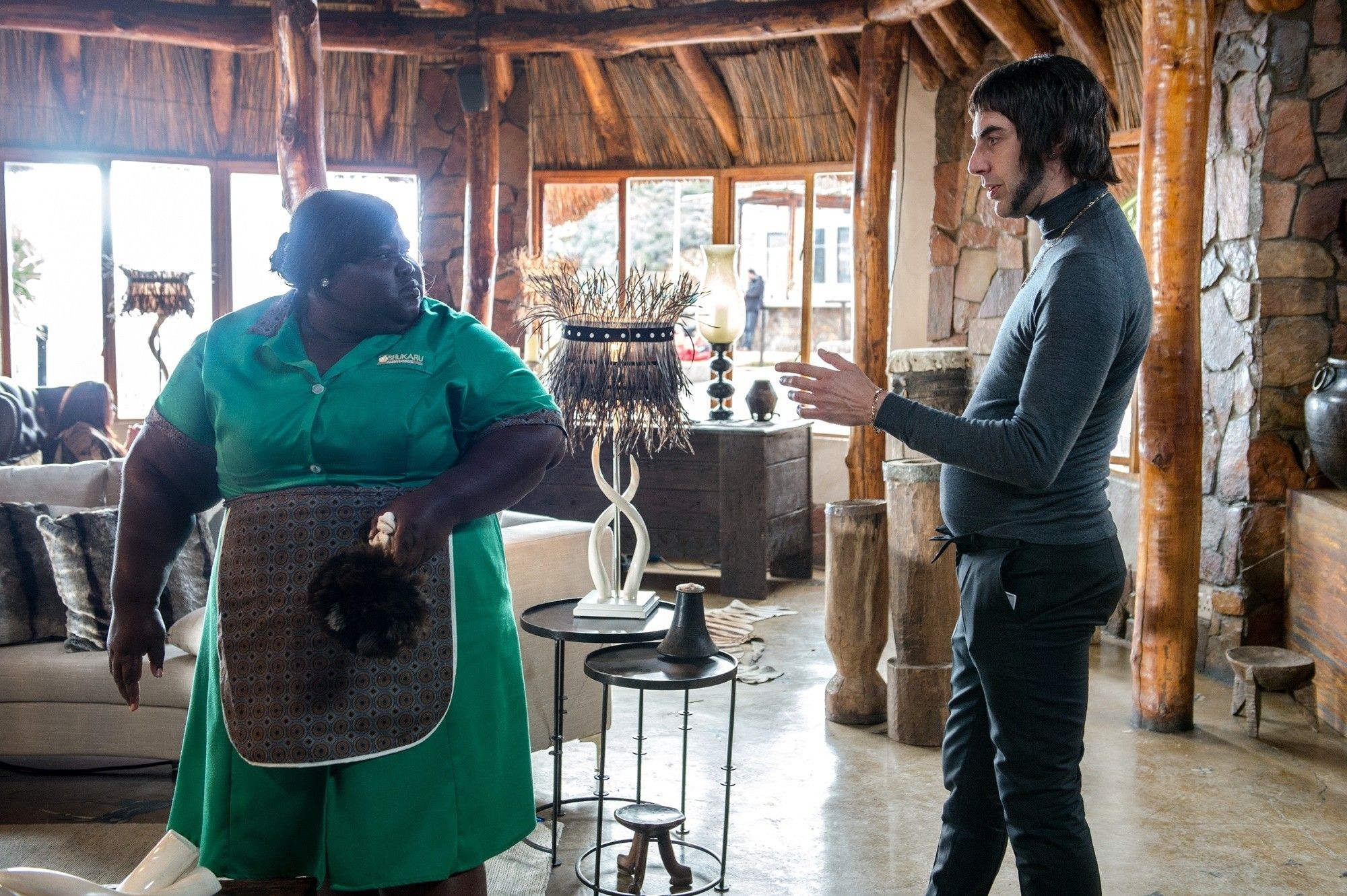Gabourey Sidibe stars as Banu the Cleaner and Sacha Baron Cohen stars as Carl 'Nobby' Butcher in Columbia Pictures' The Brothers Grimsby (2016)