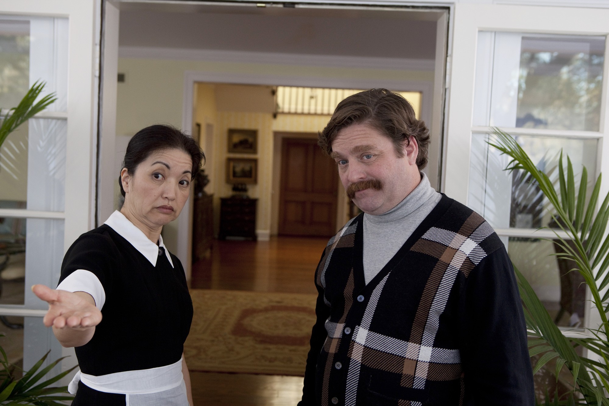Karen Maruyama stars as Mrs. Yao and Zach Galifianakis stars as Marty Huggins in Warner Bros. Pictures' The Campaign (2012)