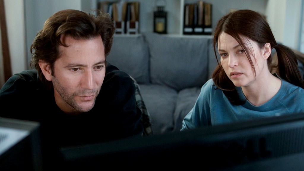 Henry Ian Cusick stars as Danny Hart and Nicki Aycox stars as Lexi in Monterey Media's The Girl on the Train (2014)