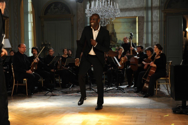 Omar Sy stars as Driss in The Weinstein Company's The Intouchables (2012)