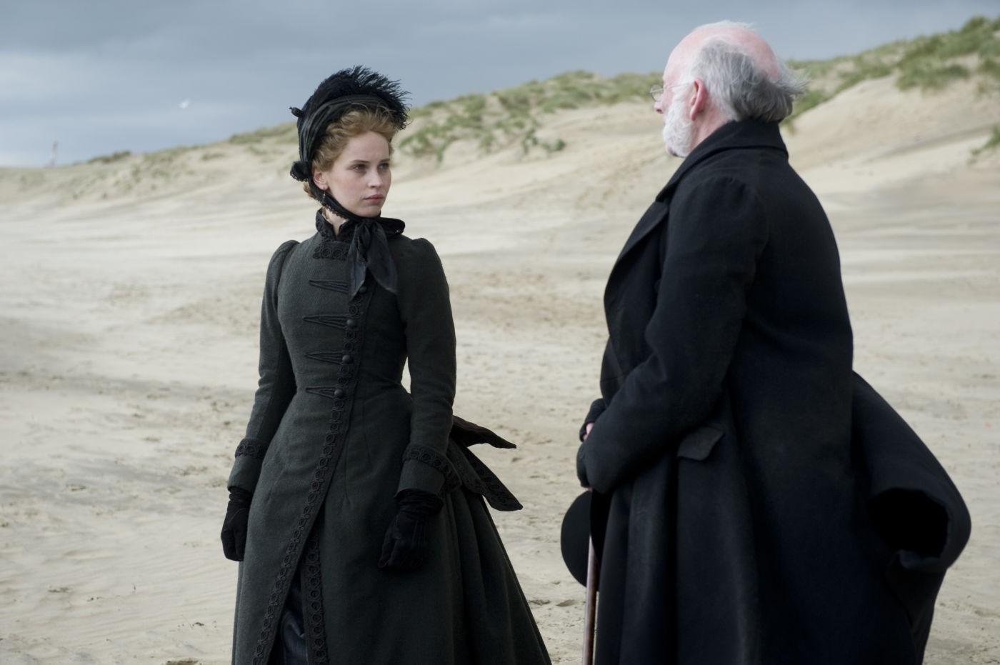 Felicity Jones stars as Nelly Ternan and John Kavanagh stars as Rev. William Benham in Sony Pictures Classics' The Invisible Woman (2013). Photo credit by David Appleby.