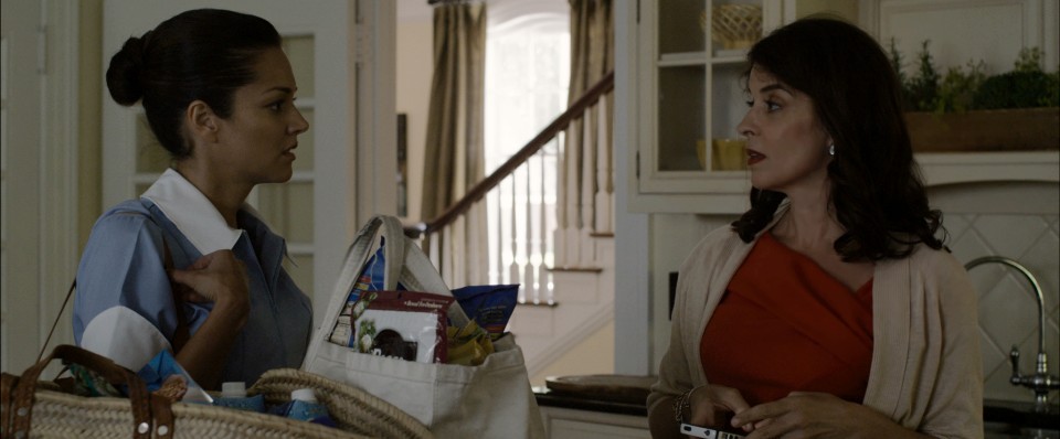 Paula Garces as Drina and Annabella Sciorra stars as Mrs. Crawford in Paladin's The Maid's Room (2014)