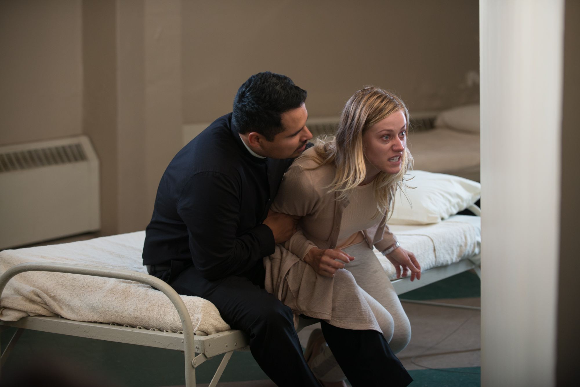 Michael Pena stars as Father Lozano and Olivia Taylor Dudley stars as Angela in Pantelion Films' The Vatican Tapes (2015)