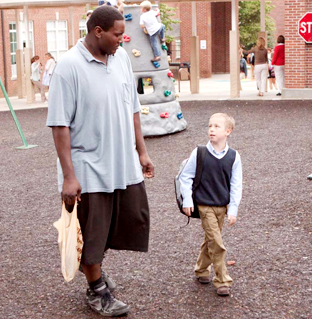 Quinton Aaron stars as Michael Oher and Jae Head stars as S.J. in The 20th Century Fox's The Blind Side (2009)