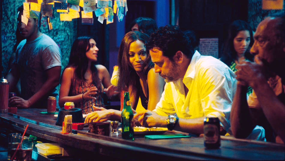 Zoe Saldana stars as Aisha and Jeffrey Dean Morgan stars as Clay in Warner Bros. Pictures' The Losers (2010)