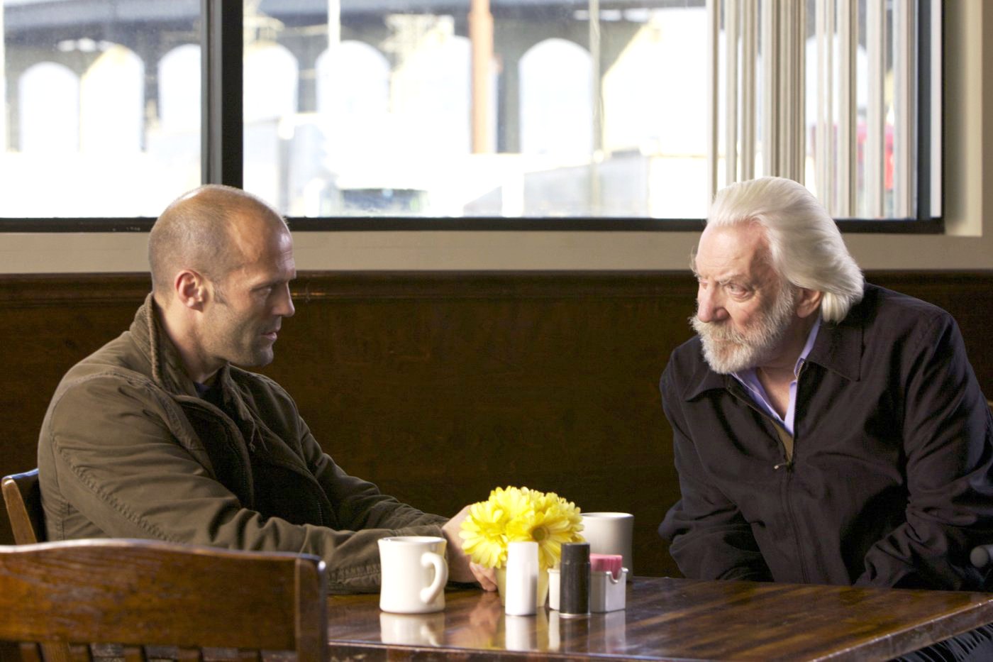 Jason Statham stars as Arthur Bishop and Donald Sutherland stars as Harry McKenna in CBS Films' The Mechanic (2011)