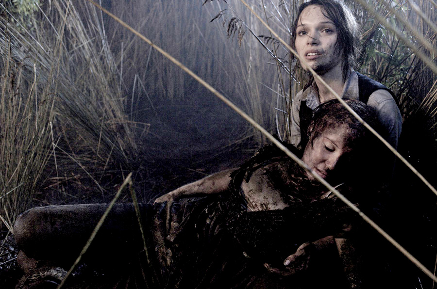 Scarlett Alice Johnson stars as Helen and Anna Brewster stars as Laura in After Dark Films' The Reeds (2010)