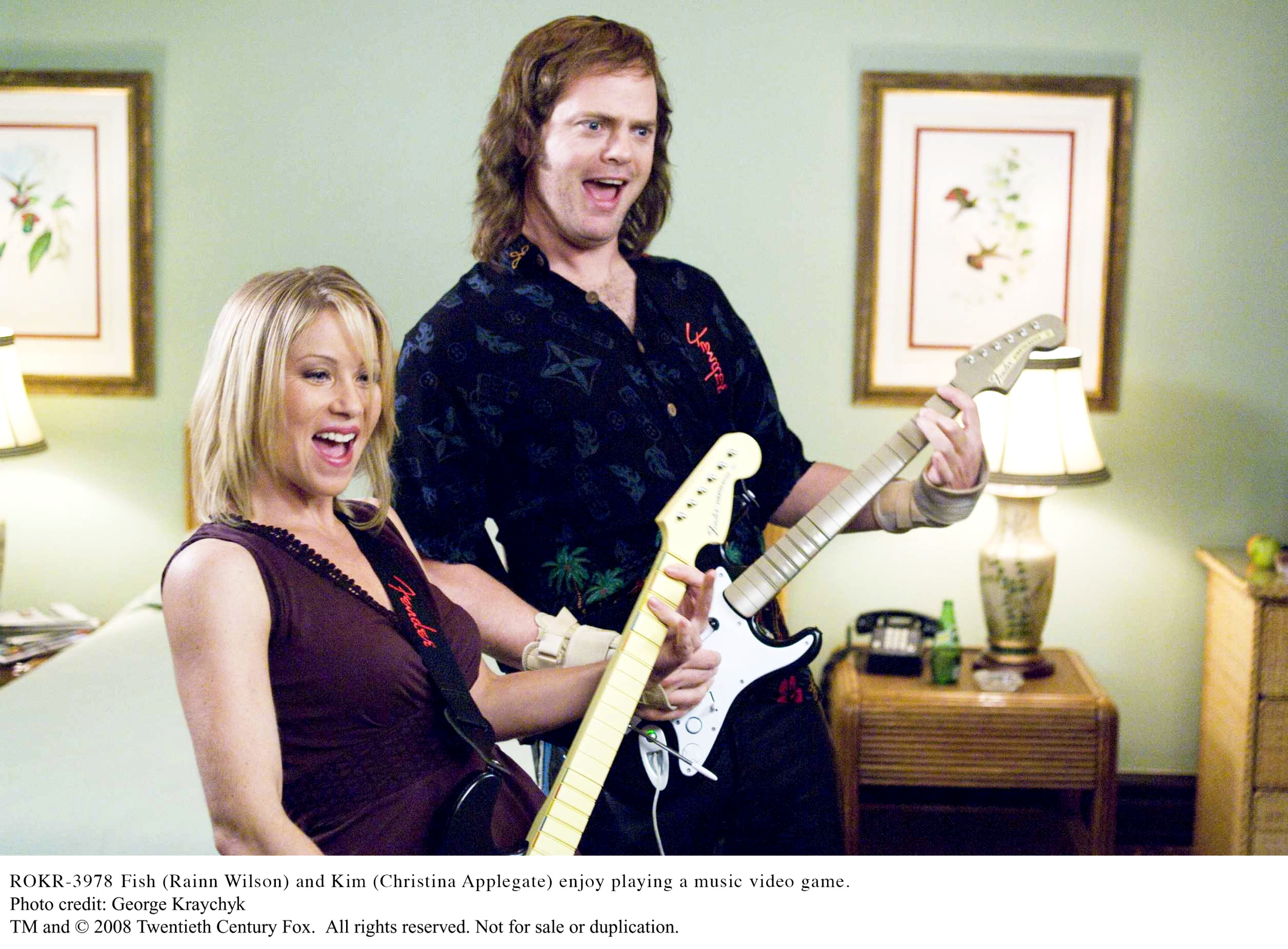 Christina Applegate stars as Kim and Rainn Wilson stars as Robert 'Fish' Fishman in 20th Century Fox's The Rocker (2008). Photo credit by George Kraychyk.