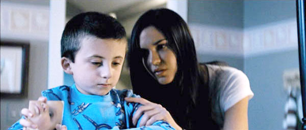 Atticus Shaffer stars as Matty Nelson and Odette Yustman stars as Casey Beldon in Rogue Pictures' The Unborn (2009)