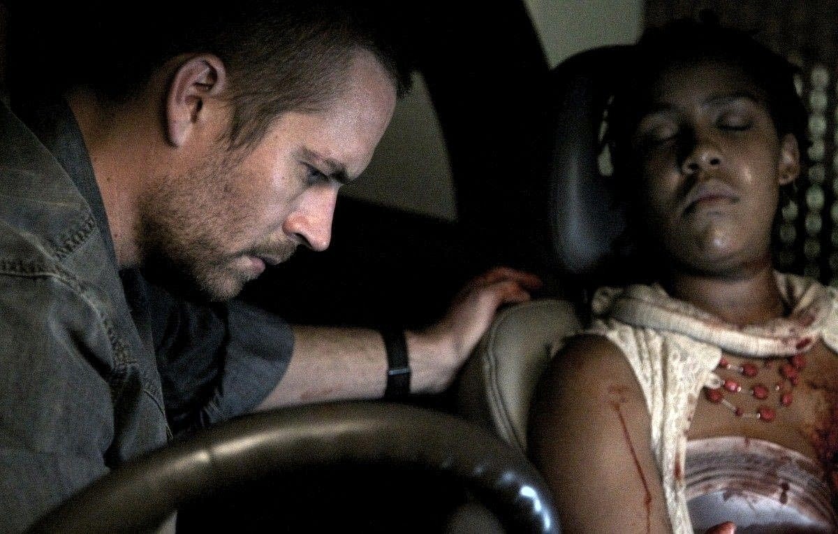 Paul Walker stars as Michael Woods and Naima McLean stars as Rachel Shabangu in Ketchup Entertainment&#39;s Vehicle 19 (2013) - vehicle-19-07
