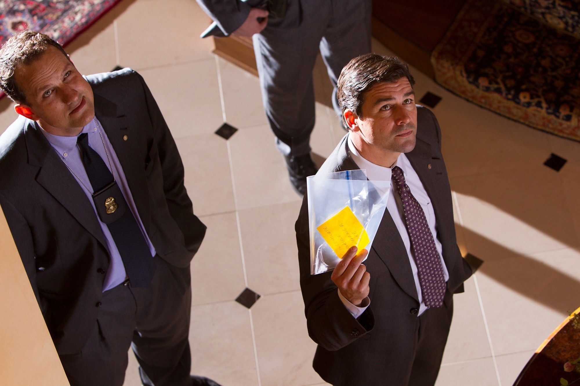 Ted Griffin stars as Agent Hughes and Kyle Chandler stars as Agent Patrick Denham in Paramount Pictures' The Wolf of Wall Street (2013)