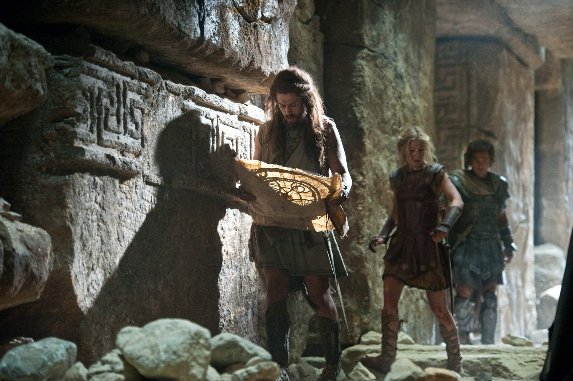 Toby Kebbell, Rosamund Pike and Sam Worthington in Warner Bros. Pictures' Wrath of the Titans (2012). Photo credit by Jay Maidment.