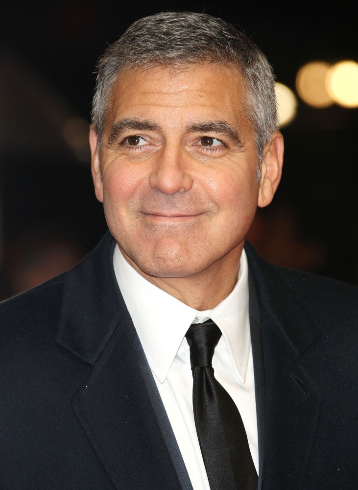 Clooney was handcuffed along 