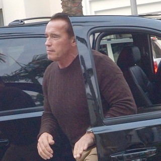 Arnold Schwarzenegger Heads to Prada on Christmas Eve