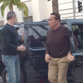 Arnold Schwarzenegger Heads to Prada on Christmas Eve