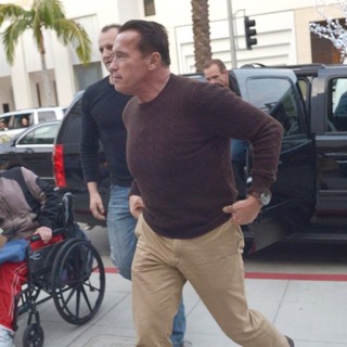 Arnold Schwarzenegger Heads to Prada on Christmas Eve